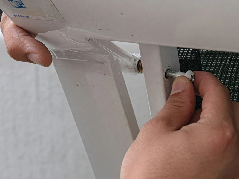Bolt the sling rails back onto the frame