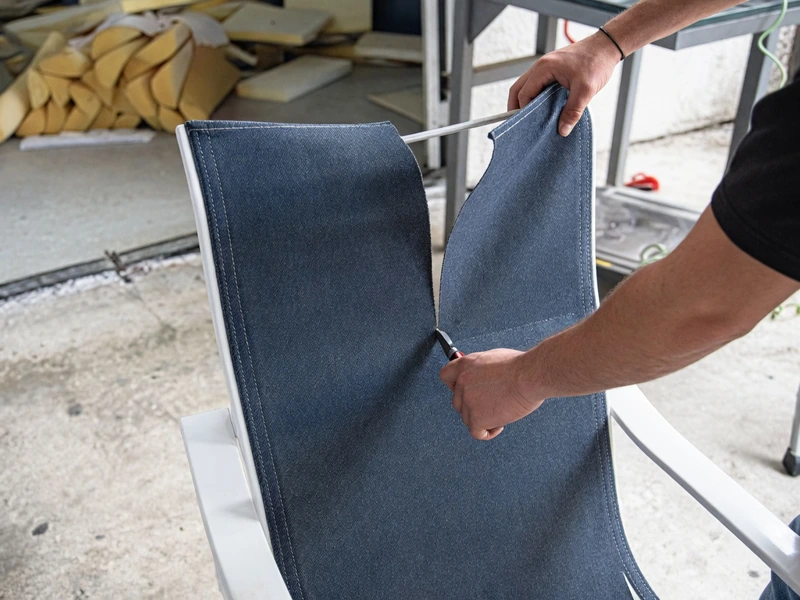 Cut the old sling material down the middle