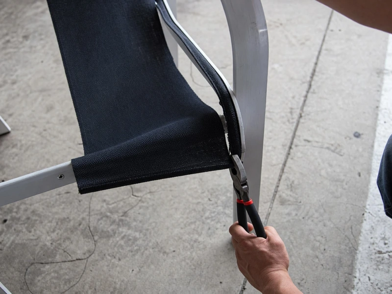 Pull the old sling material out with pliers
