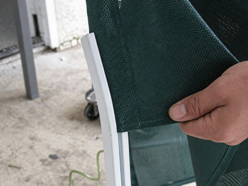 Slide the new sling material onto the frame rails